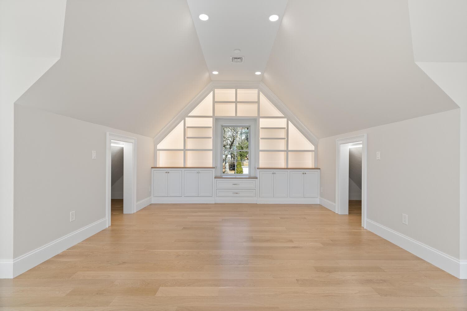 Open kitchen with white cabinetry, dark cherry island, and coffered tray ceiling