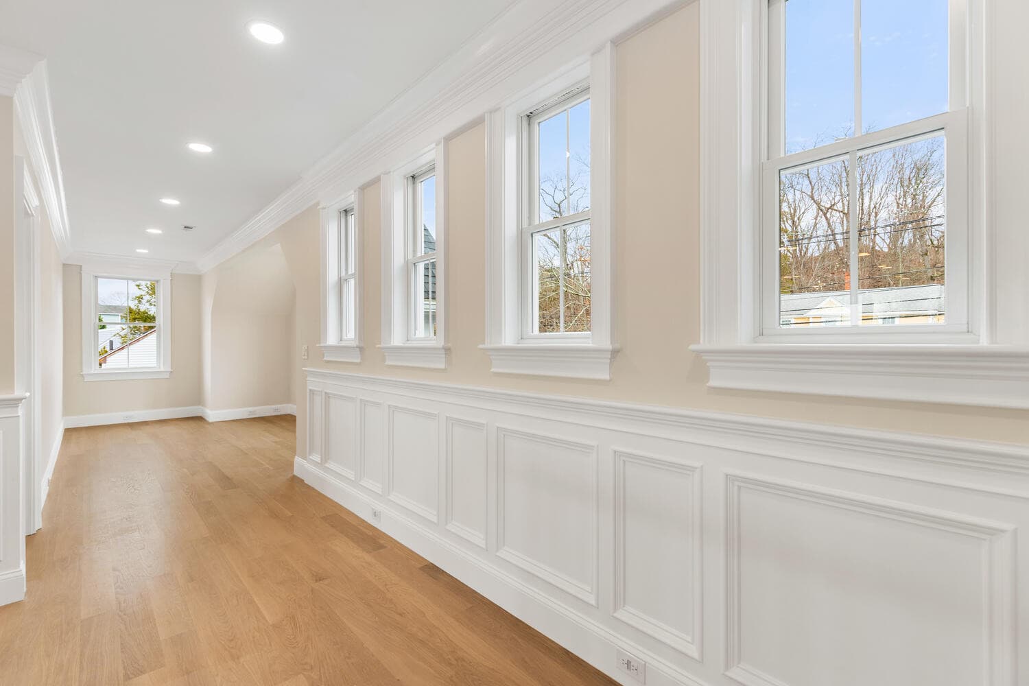 Second floor study nook with wainscoting and window seat